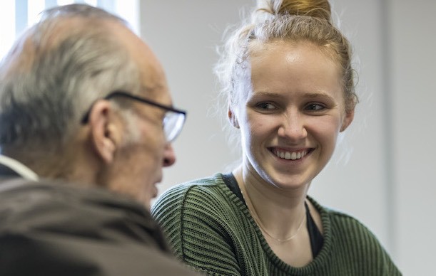 Student Volunteer and Older Person in Conversations
