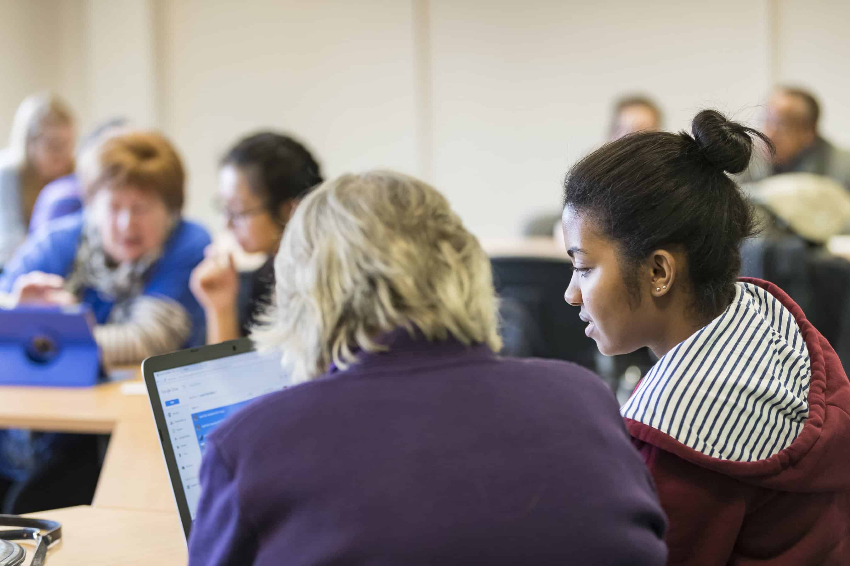 Students and Older People at Oxford Hub IT Lesson