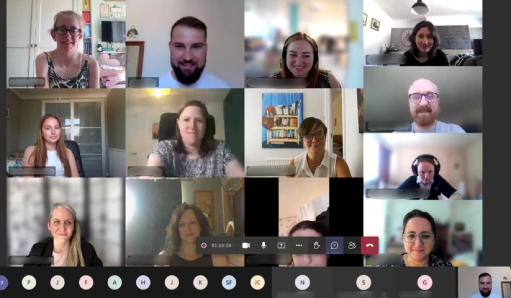 Screenshot of a Microsoft Teams call with everyone smiling