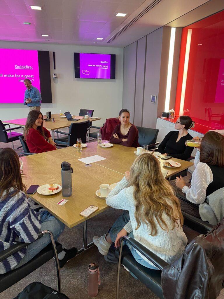 A table of students in discussion.