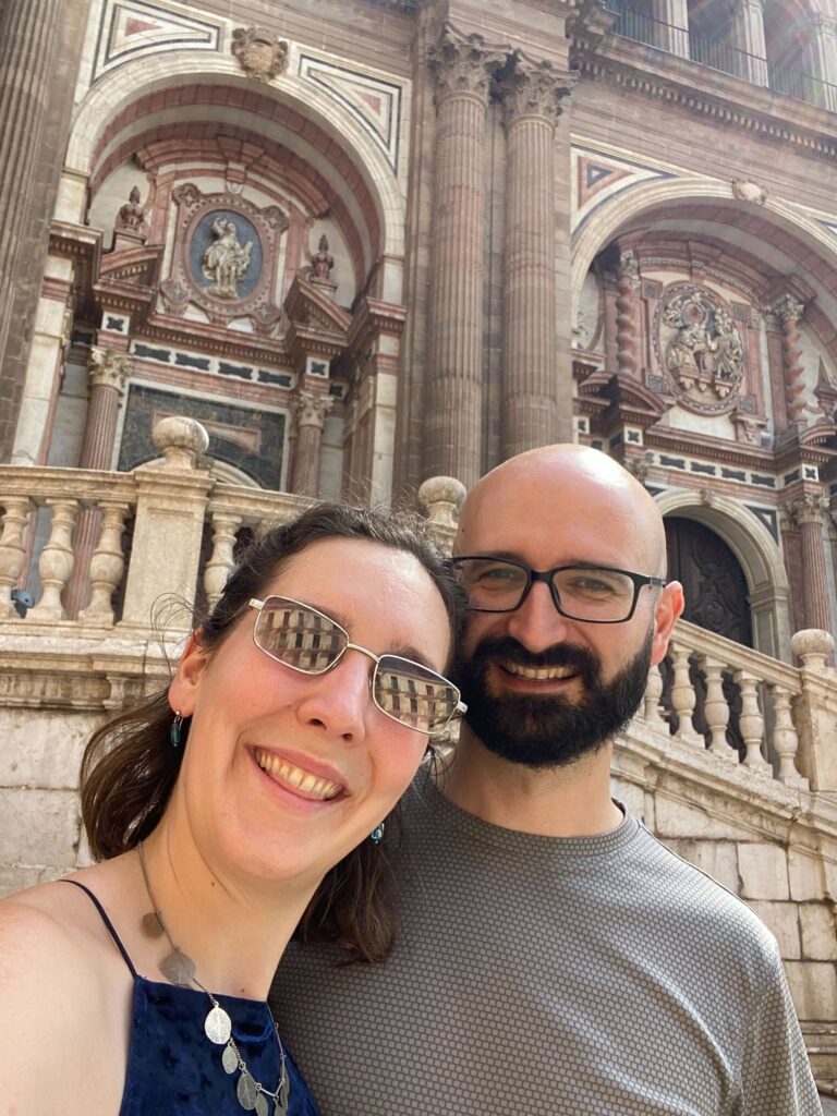 ID: Sorcha and her partner taking advantage of the long weekend to travel abroad. The photo shows them both smiling at the camera.