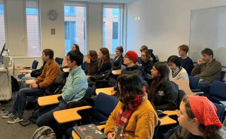 ID: a room full of students taking part in a carbon literacy project session