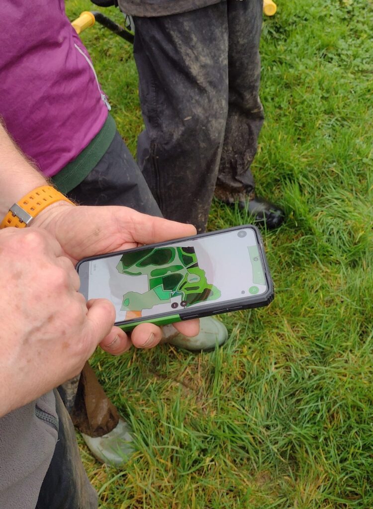 ID: a phone screen showing a map of tree-planting locations
